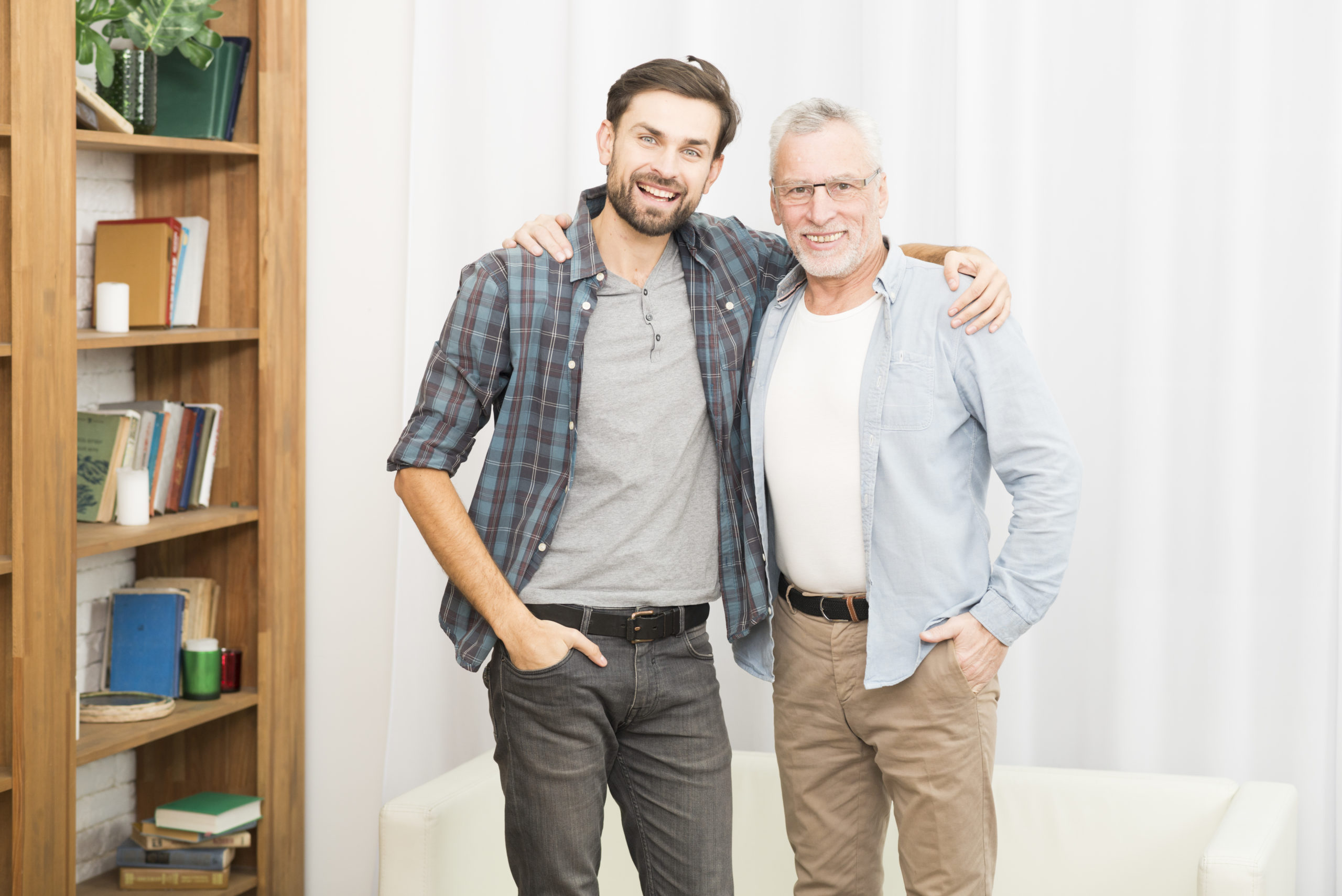 aged-man-hugging-with-young-happy-guy